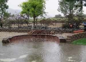 The wood is floating and it's now at flood stage in the pit