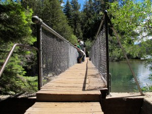 A family checking out what is below them from the Fallen Leaf Dam