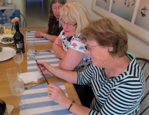 Lynda is examining the antique