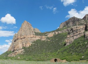 Thimble Rock is impressive behind the Driggs Mansion, home of a pioneer in the early 1900s.
