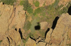 The shadow of our tram going down hill.