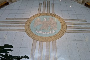 New Mexico's Great Seal in the middle of the Zia symbol