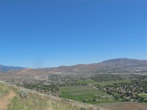 Looking northwest. The white buildings in a row at the base of the mountain/hill in the center are the Carson Tahoe Hospital.