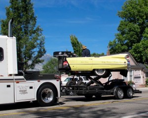 A huge semi truck was towing a guy in a totally crazy reconfigured Cadillac with amps in lieu of the hood and a keyboard where the dash should be. The car elevates and turns around in circles while he is playing the keyboard. Totally bizarre!