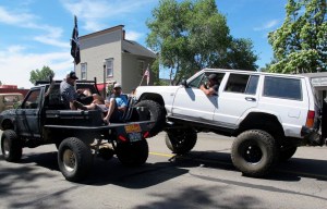 Nonchalant dudes in the back of the vehicle to the left.