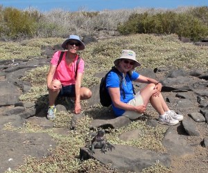 Right in the midst of all the albatross was a marine iguana high on a bluff. I wondered why he was so high above the surf line. Shirley and I took advantage and had our portrait taken with him.
