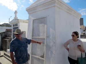 Our carriage driver is pointing to the Glapion family tomb where the remains of voodoo queen Marie Laveau are said to rest. You can see in the background that there are many shapes and sizes of tombs in the cemetery.