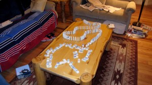 Dalan went to spend the night with a friend and Megan stayed with me. Our last activity before going to bed was this domino train we built. Megan is really good at it and can make them fall just perfectly. Some are still standing because this is an action shot.
